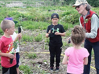 USU’s Karen Mock guides youngsters in conservation project