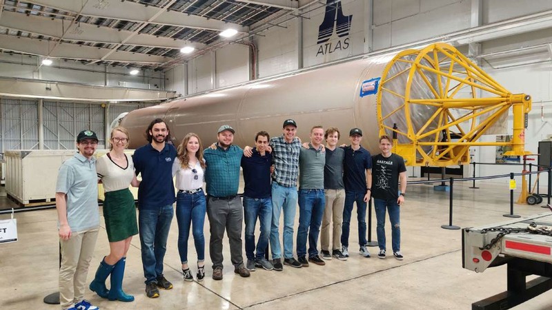 USU's Get Away Special Team poses for a group photo in front of space exploration equipment.