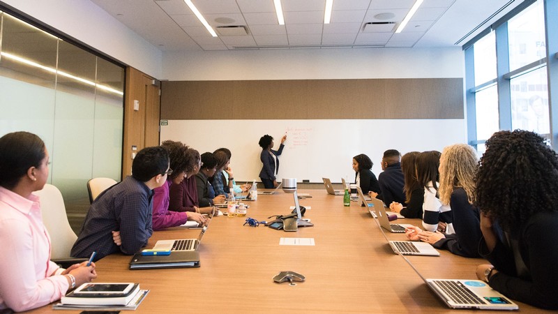 People sit in a conference room.