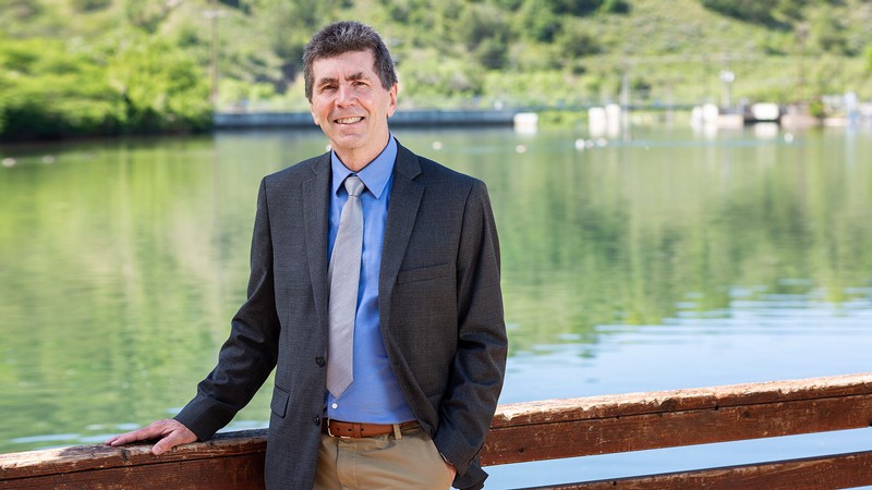 David Tarboton poses for a picture in front of First Dam in Logan Canyon.