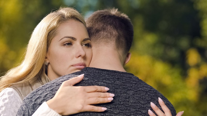 A couple embracing.