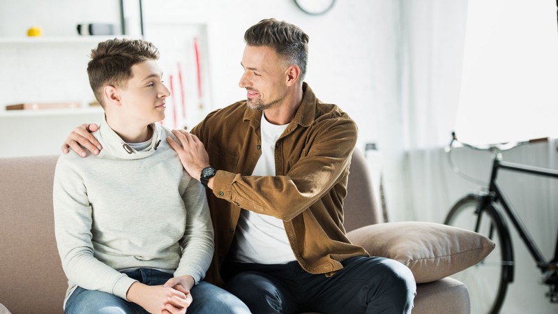 A father talks to a son.