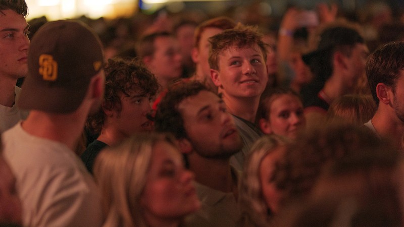 People stand in a crowd