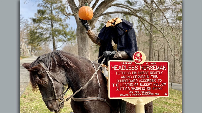 A plaque and sculpture commemorating the Headless Horseman.