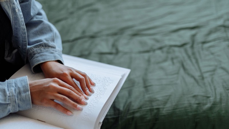 A person reading Braille.