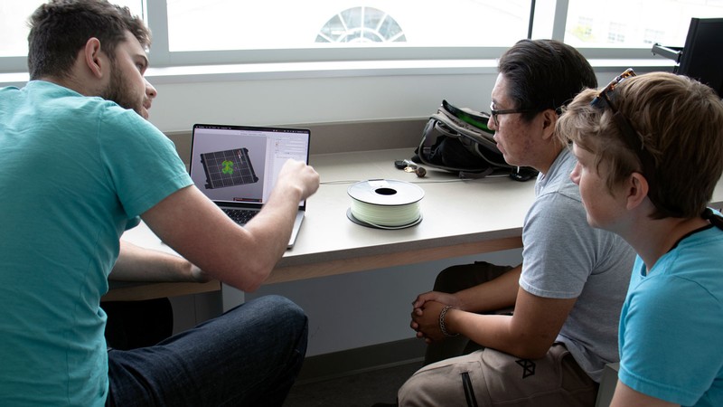 Researchers at a computer.