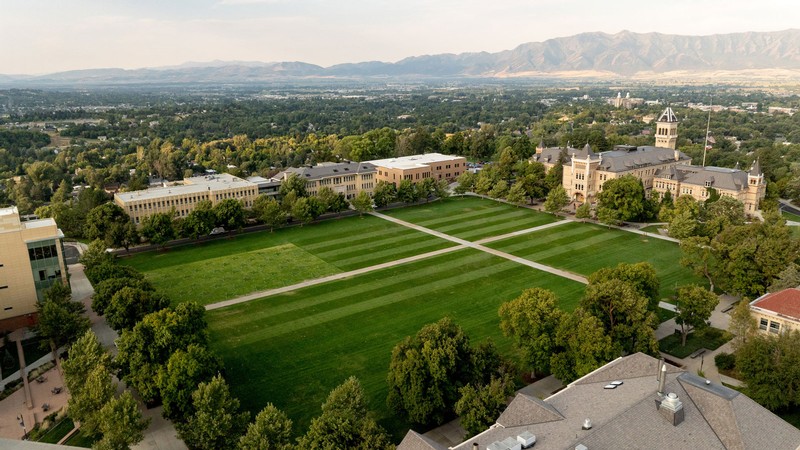 An aerial view of an American flag mowed into grass on USU Logan's Quad.