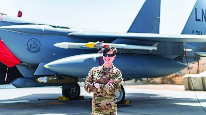 Isabella Muffoletto in front of a fighter jet.