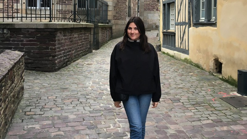 Mayu Mecham on a cobblestone street.