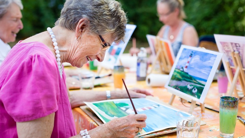 A person painting with watercolors.