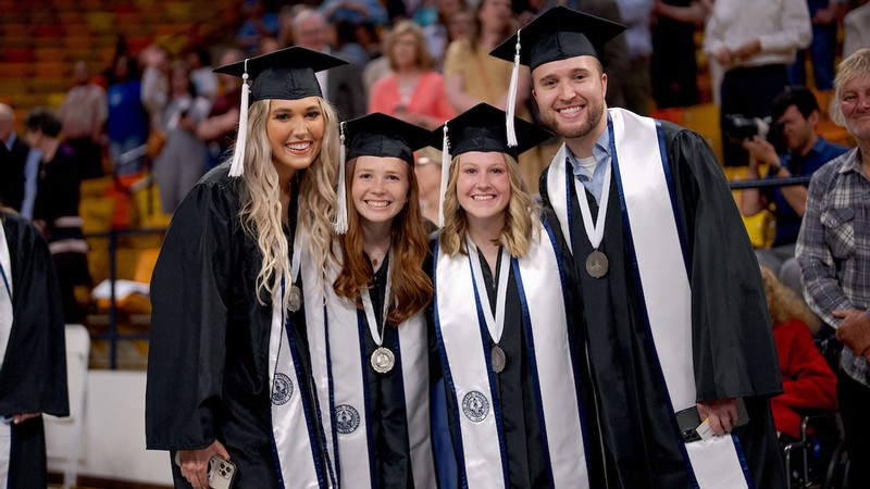 People in graduation robes.