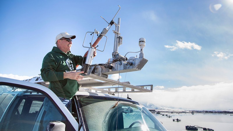 Randy Martin adjusts air quality instruments.