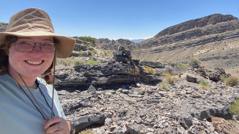 Michelle Norman standing in a desert.
