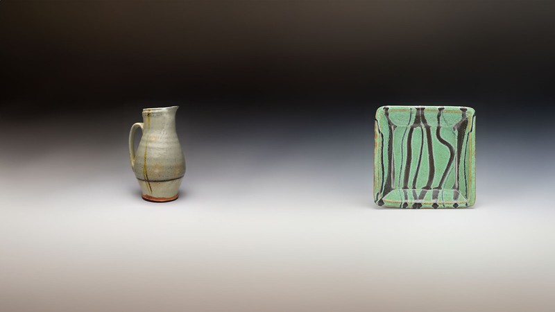 A ceramic pitcher and plate.