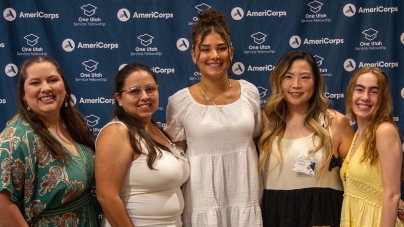 People posing for a photograph at an awards ceremony.