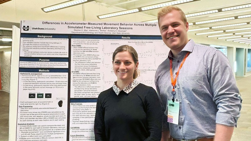 Researchers by a poster.