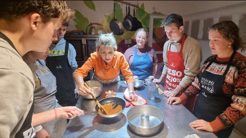 Students taking a cooking lesson.
