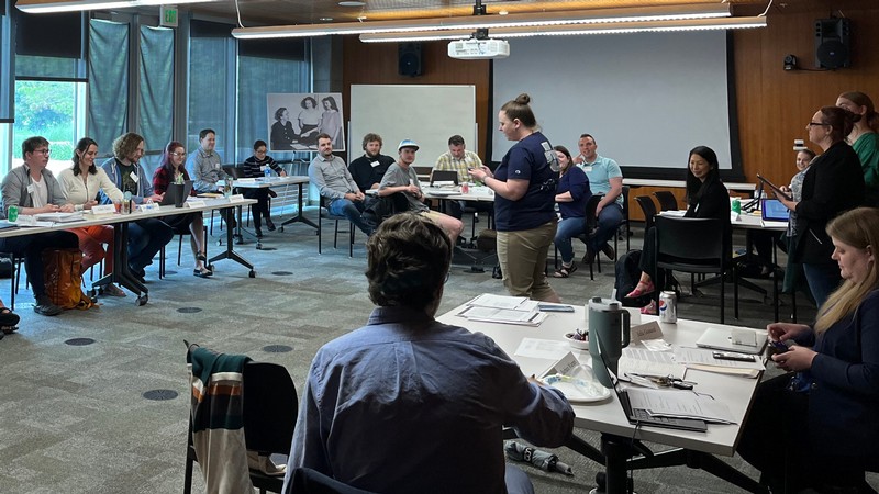 People participating in an educational workshop in a classroom.