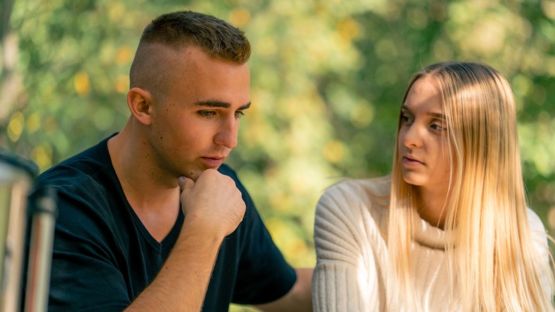 Two people talking.