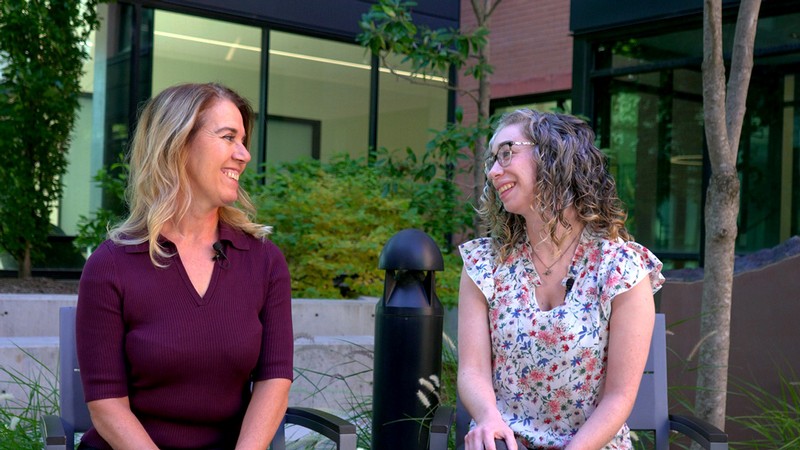 Tressa Johnston and Cari Gongora speaking outdoors.