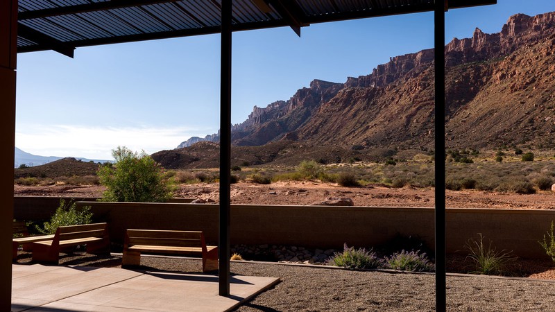 Redrock cliffs seen from a patio area.