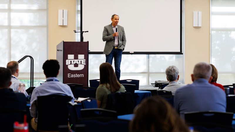 A person speaking at a conference.