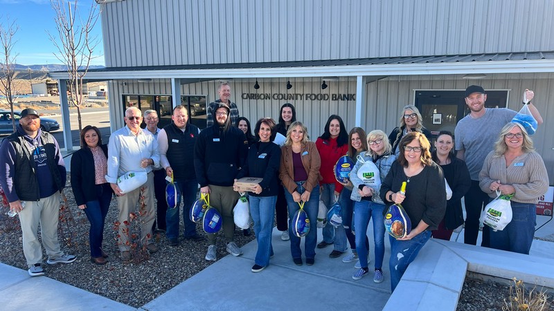 Volunteers posing for a group photo outside the Carbon County Food Bank.