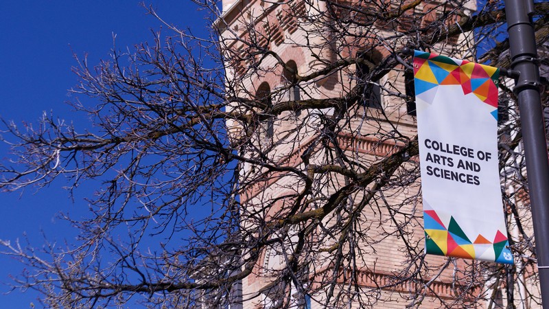 A banner on USU's Logan campus reads "College of Arts and Sciences."