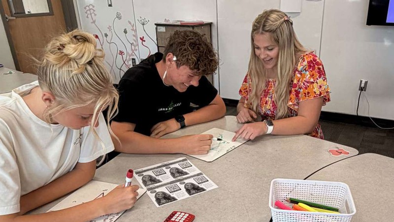 A math teacher and students.