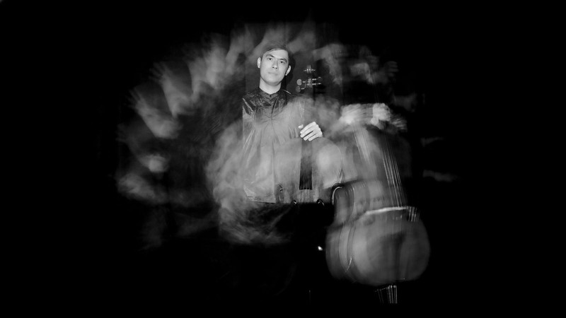 A stylized photo of cellist Zlatomir Fung.