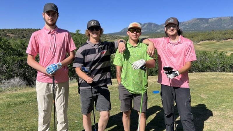 Golfers posing for a photo.