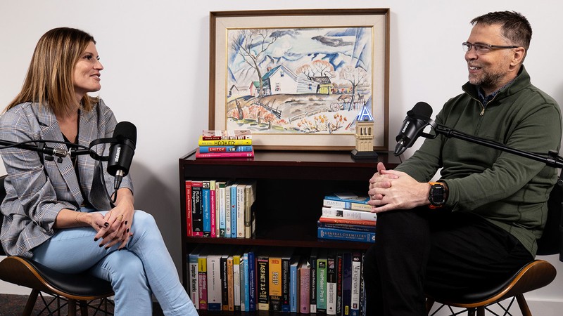People recording a podcast.