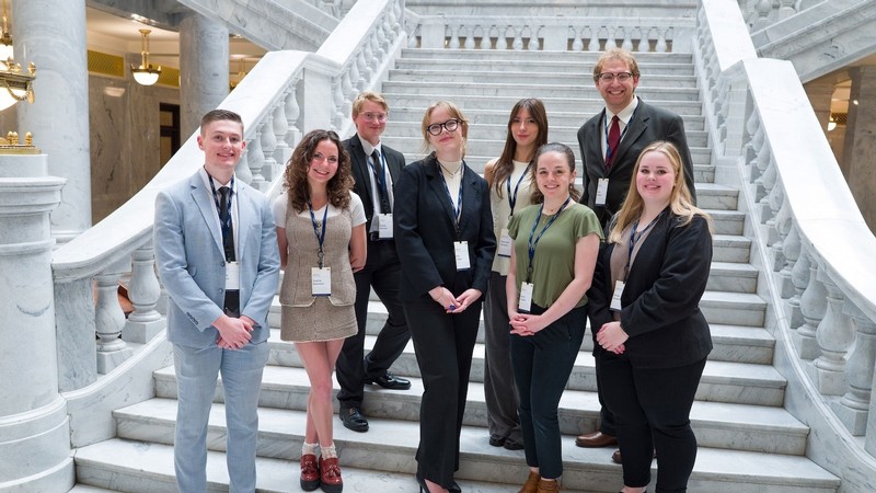 Students standing on a staircase in the Utah Capitol.