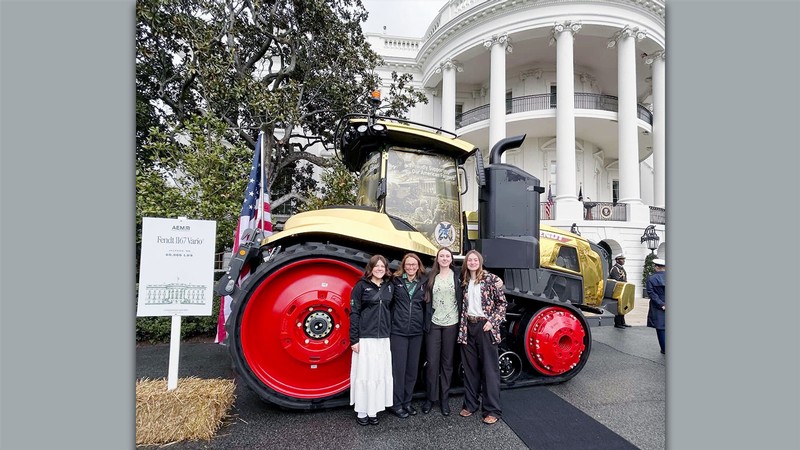 Students in front of a tractor in front of the White House.