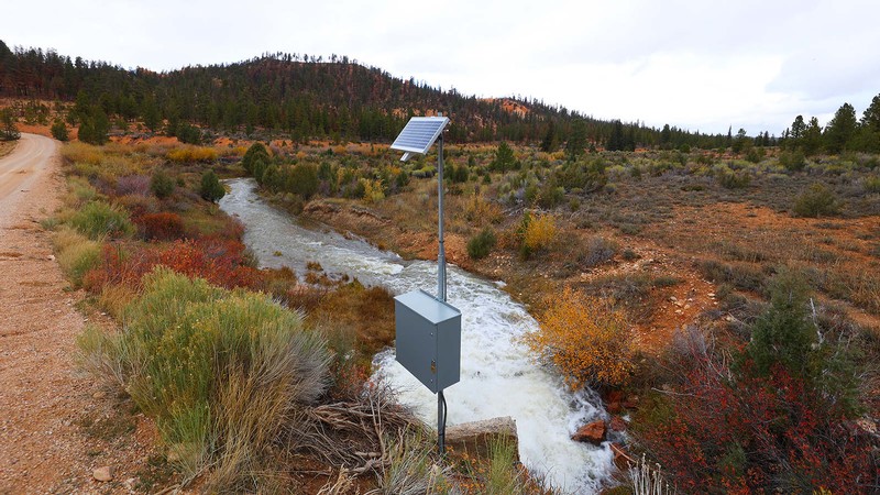 A water gage on a creek in a hilly area.