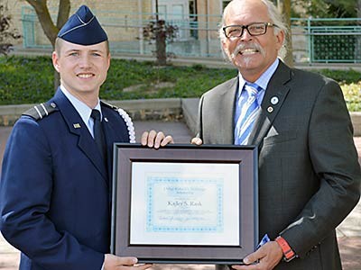 Rich Etchberger presenting the Etchberger Scholar Award to Cadet Kajler Rask