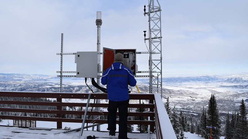 Uintah Basin Graduate Student Tyler Elgiar installing the inlet.
