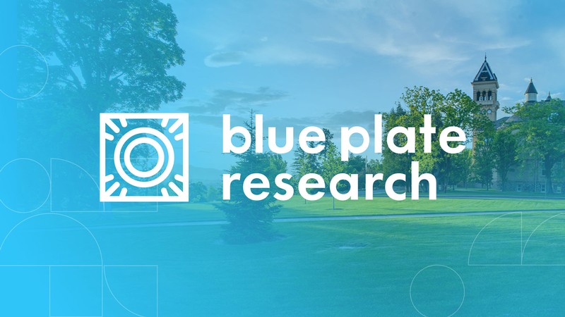 Blue Plate Research words with Old Main in the back.