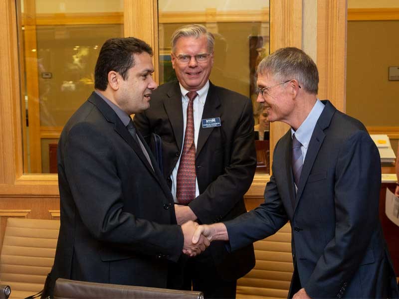 Rector Anderson Ribeiro Correia with USU Provost Francis Galey and USU Professor Charles Swenson