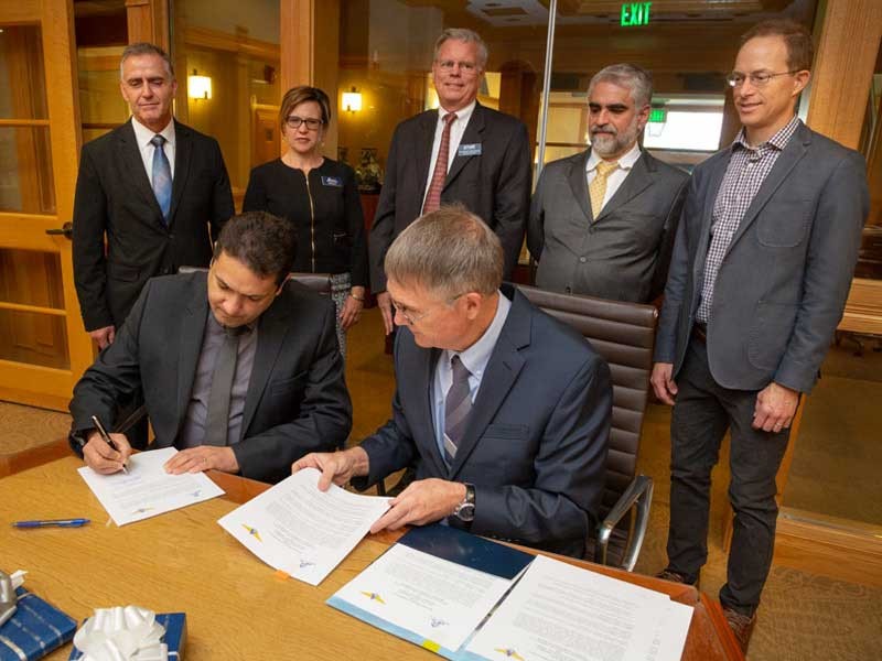 Rector Anderson Ribeiro Correia with USU Provost Francis Galey and others