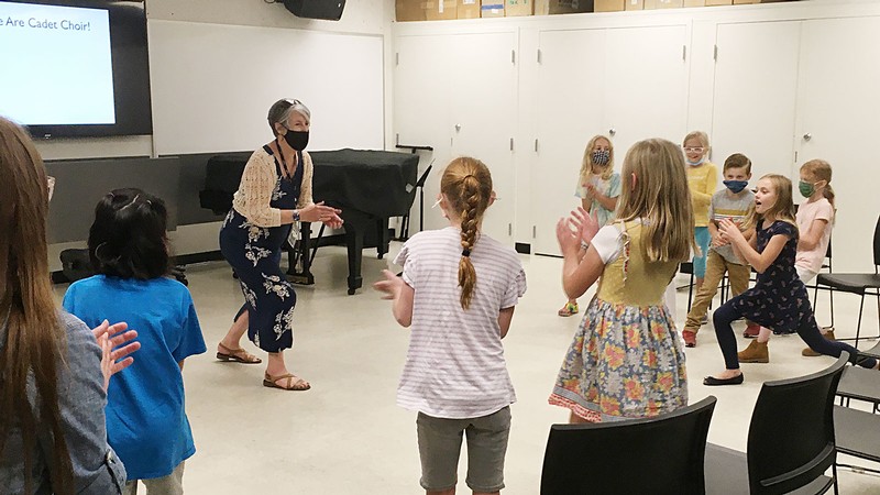 Leslie Timmons teaches a music class with children.