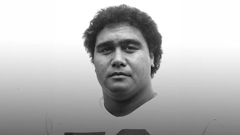 A black and white photo of a former USU athlete.