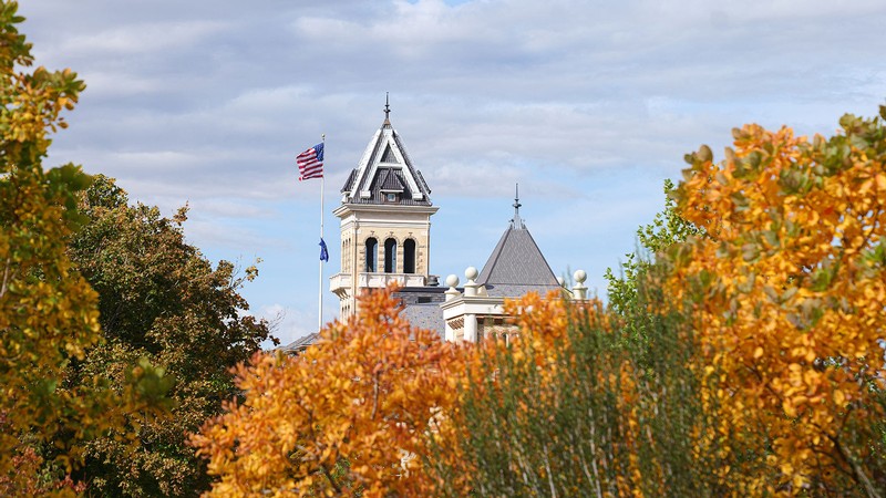 Old Main with fall leaves in the background.
