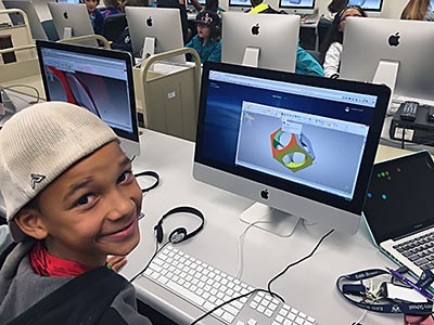 a boy at USU's Young Education Technology Center