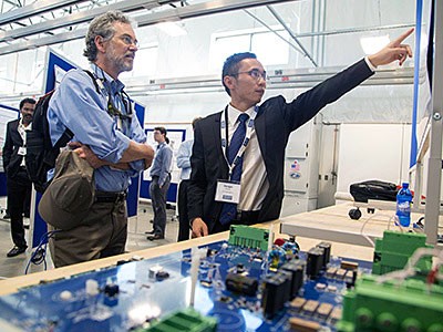 USU student researcher discussing his research on the autonomous bus