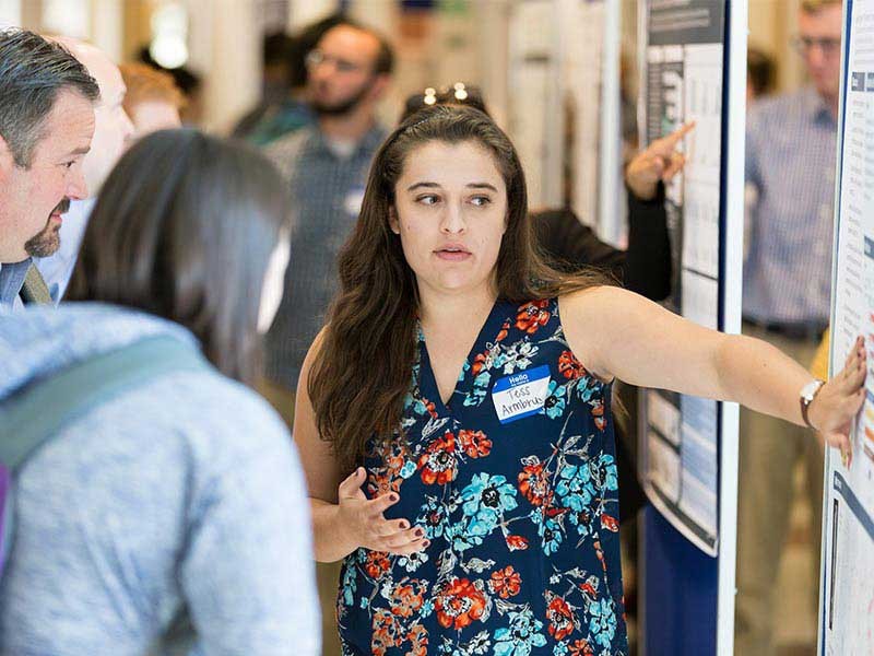 woman researcher explaining her research.