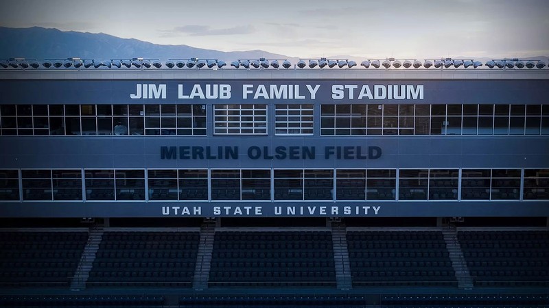 The facade of the USU football stadium, showing the new name.