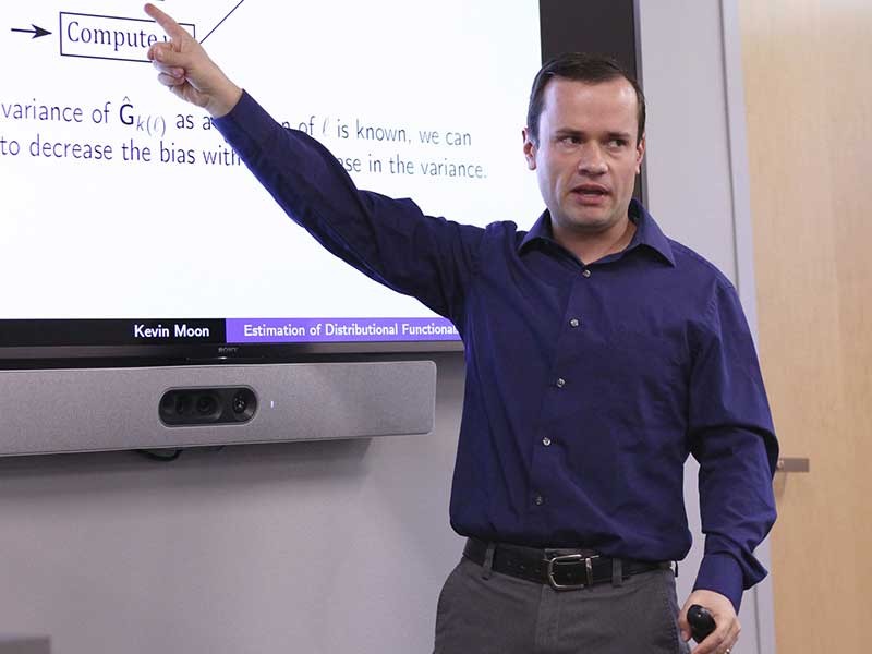 USU data scientist Kevin Moon speaking at colloquium