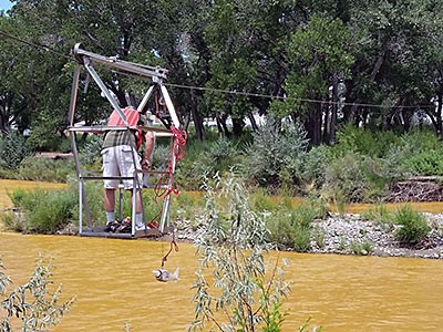 A scientist taking samples from the Animas River in New Mexico after the Gold King Mine spill