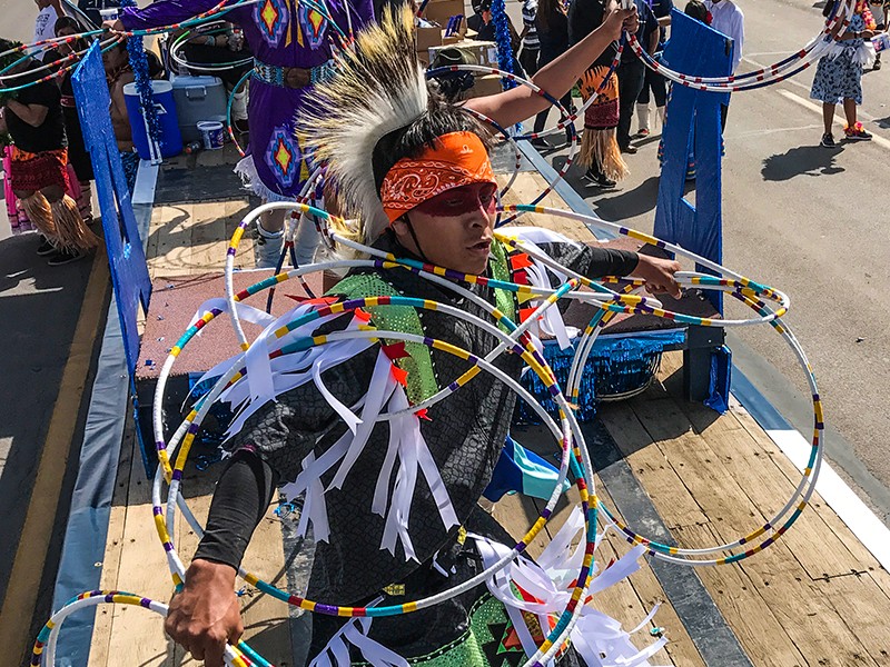 student dancing in parade